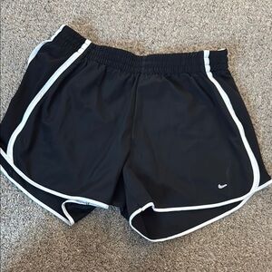 Nike Black Athletic Shorts with Curved Hem and Elastic Waistband